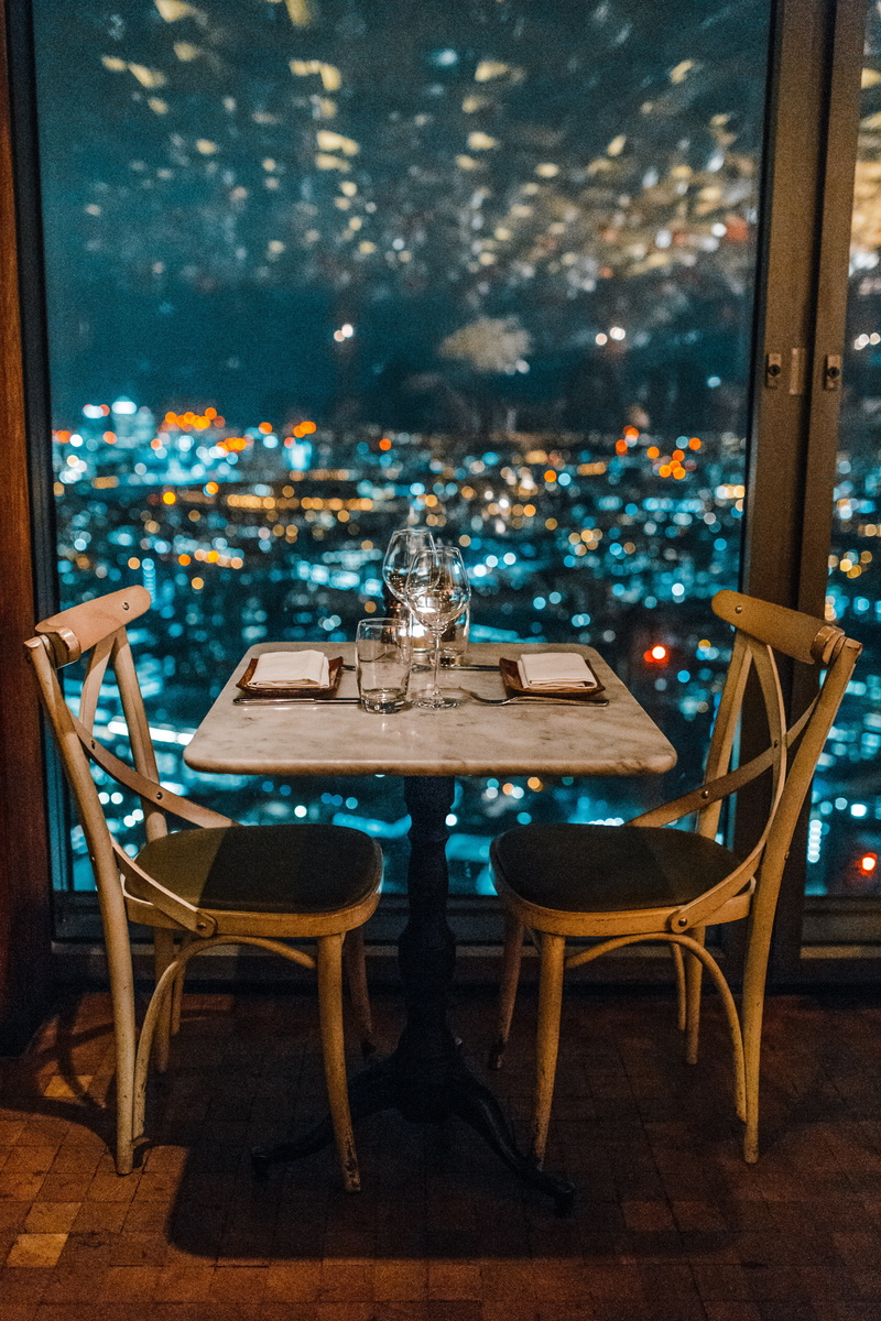 business, cityscape, wood - material, gray, two, setting, arrangement, glass - material, transparent, dinner, window, indoors, chair, decoration, lights