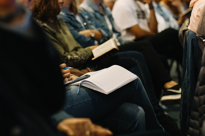 cell phone, write, incidental people, reading, group, activity, university student, meeting, praise, crowd, holding, church, chair, selective focus, worship service