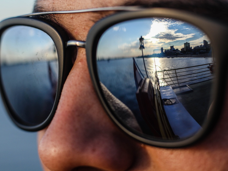 cloud - sky, leisure activity, one person, reflection, nature, glasses, sky, real people, solitary, body part, fashion, water, peoples, day, city, sad