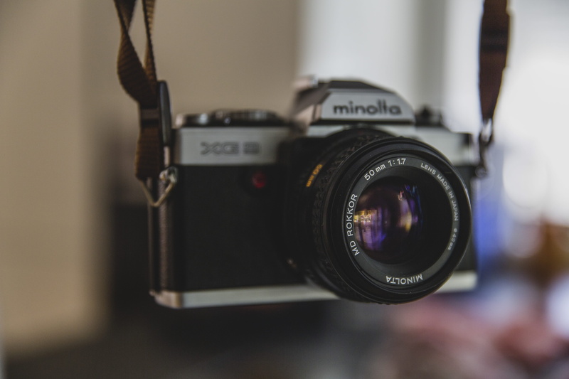 text, focus on foreground, SLR, slr camera, gadget, no people, camera, activity, lens, black, dslr, lens - optical instrument, indoors, classic, camera - photographic equipment