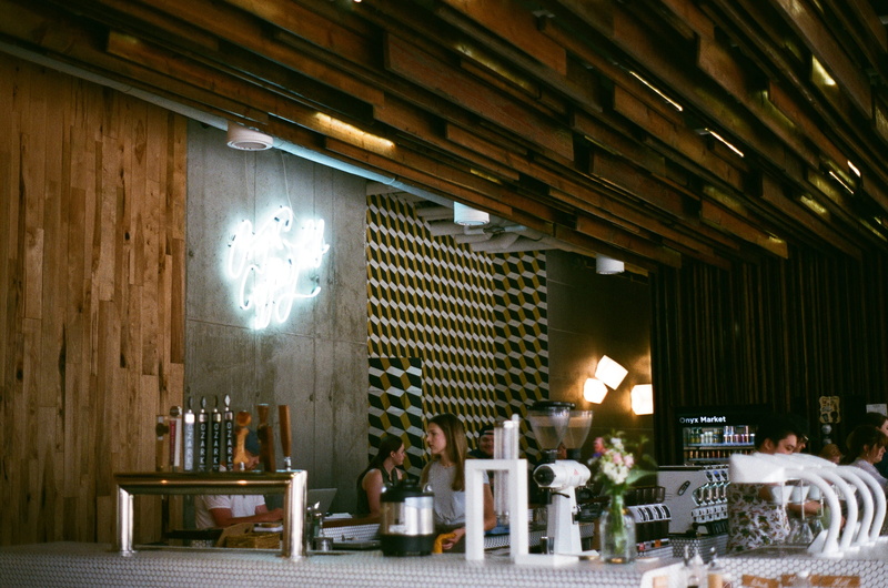 table, minolta, architecture, lighting equipment, wood - material, group of people, food, chair, built structure, 35mm, coffee, united states, indoors