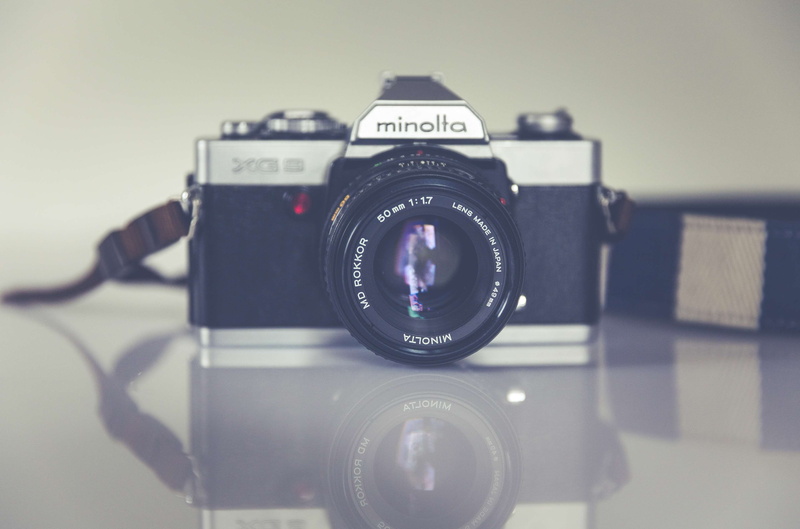 silver, minolta, focus on foreground, modern, lens - optical instrument, classic, slr camera, media, photography themes, western script, antique, photographic equipment