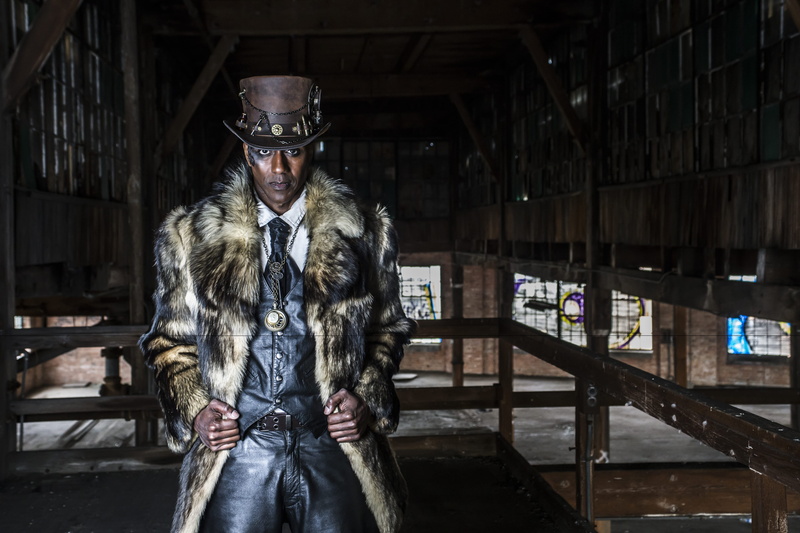 architecture, mid adult men, steampunk, intense look, costume, male, portrait, real people, mid adult, clothing, black man, three quarter length, front view