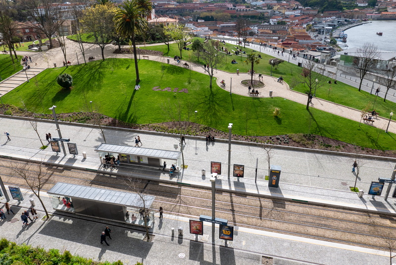 incidental people, day, metro, architecture, mode of transportation, park, outdoors, travel, street, jardim do morro, city, grass, water, green color, porto