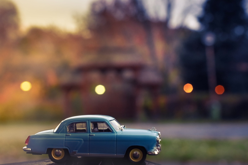 dusk, 5K, city street, toy car, boy, selective, traffic, government, sign, road, city, scale, daytime, no people, mode of transportation, focus, city life