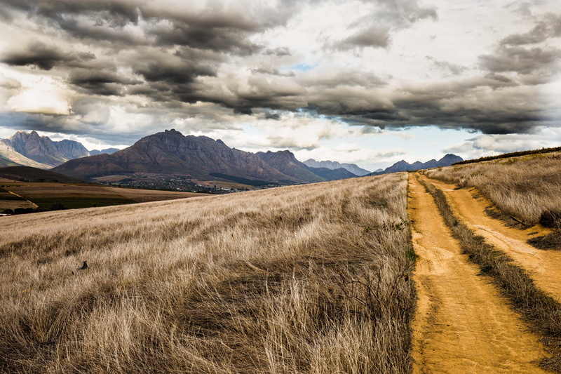 sky, beauty in nature, non-urban scene, idyllic, south africa, no people, mountains, cloud - sky, tranquility, land, day, nature, dirt road, grass fields