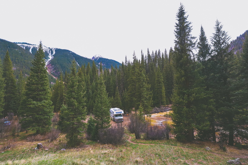 nature, vacation, mountain, sky, forest, coniferous tree, rv, no people, tourist, motor vehicle, caravan, mountains, vehicle, mode of transportation, land vehicle