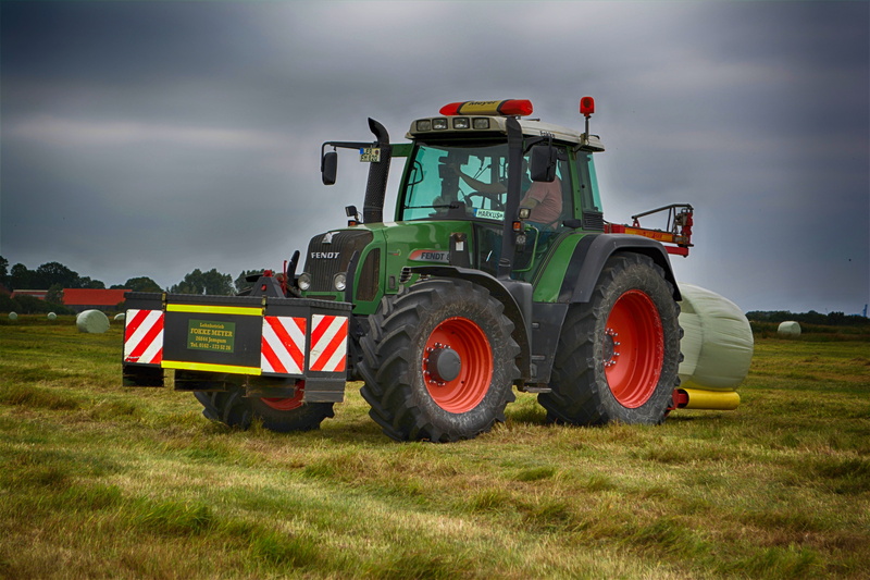 grass, land vehicle, environment, day, rheiderland include a, machinery, agricultural equipment, cloud - sky, cattle feed, midlum, transportation, working machine