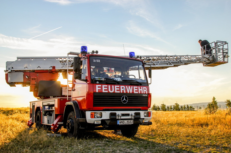 plant, truck, occupation, vehicles, two people, real people, turntable ladder, outdoors, accidents and disasters, rescue, teamwork, sky, cloud - sky, sun