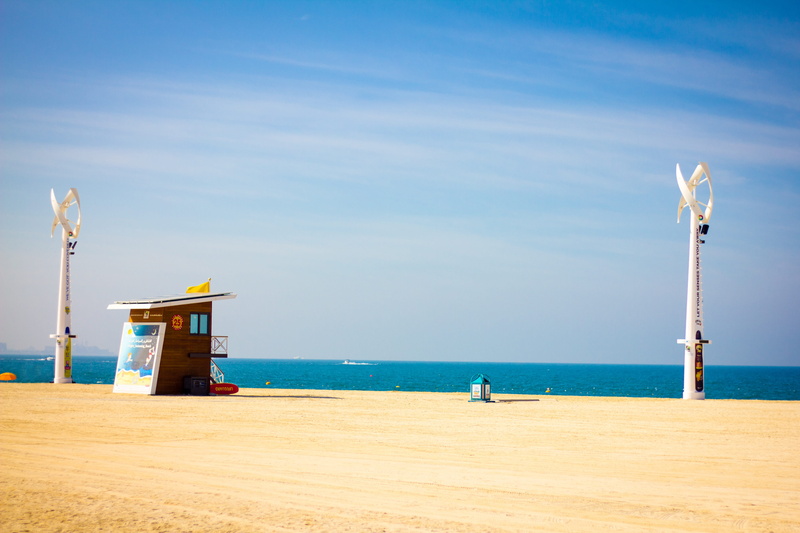cloud, coast, horizon over water, outdoors, land, waters, architecture, sand, current, environment, tranquility, landscape, pinwheel, blue, beauty in nature