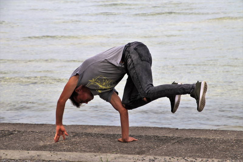 happy, self-awareness, wellbeing, outdoors, full length, beach, fun, pants, on hand, cheerful, leisure activity, day, adventure, expression, exercising