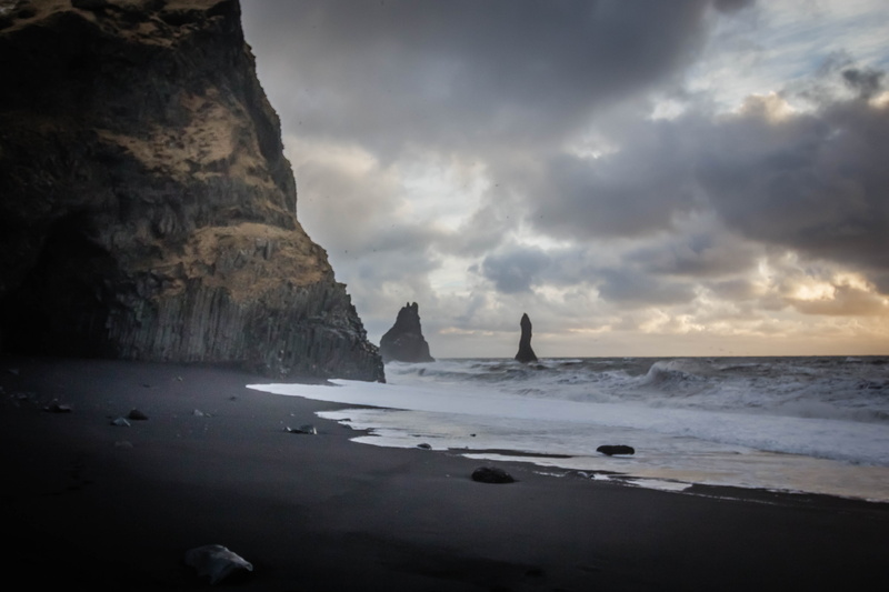 non-urban scene, stack rock, beauty in nature, iceland, solid, outdoors, rock formation, tranquility, rock, horizon, water, beach, black sand, rock - object