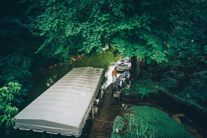 noblesville, full length, one person, bridge, transportation, lakehouse, green color, cove, water, orange, boat, mode of transportation, day, beside, standing