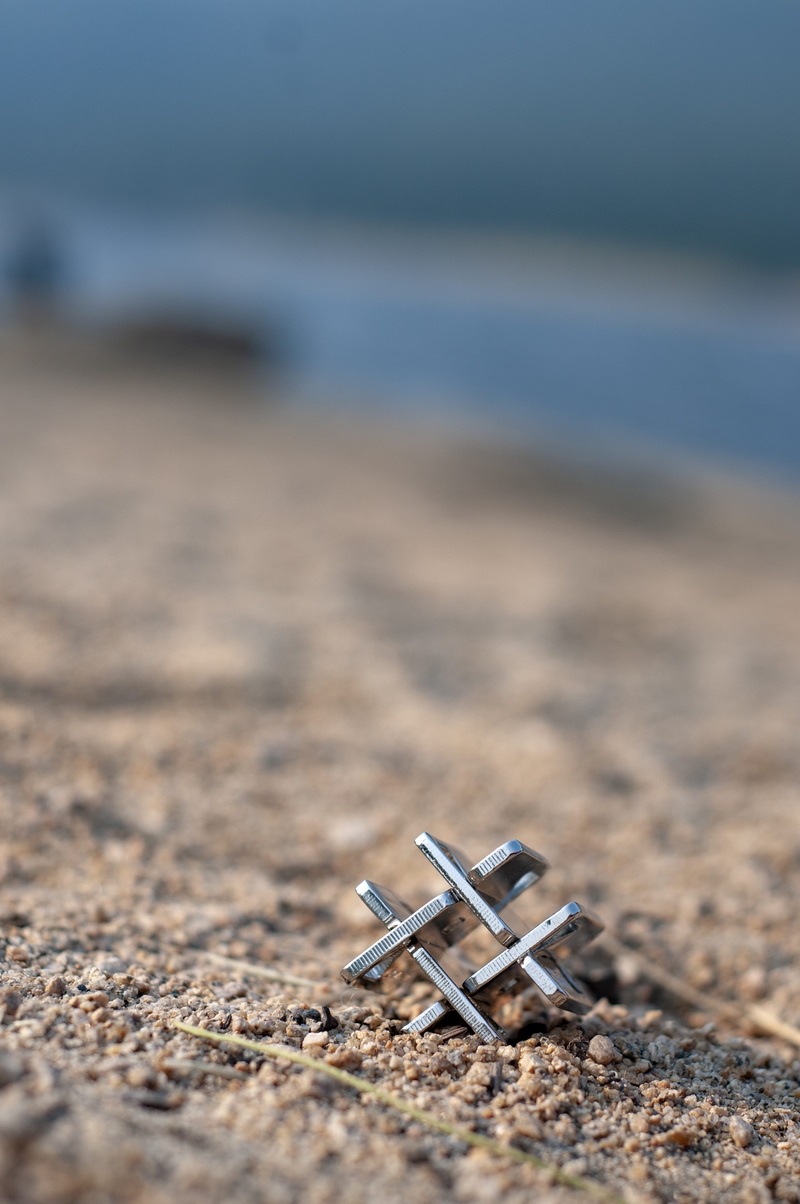 product, single object, nature, day, 4K, no people, belief, cross, brain teaser, religion, hope - concept, land, hanayama, puzzle, close-up, outdoors