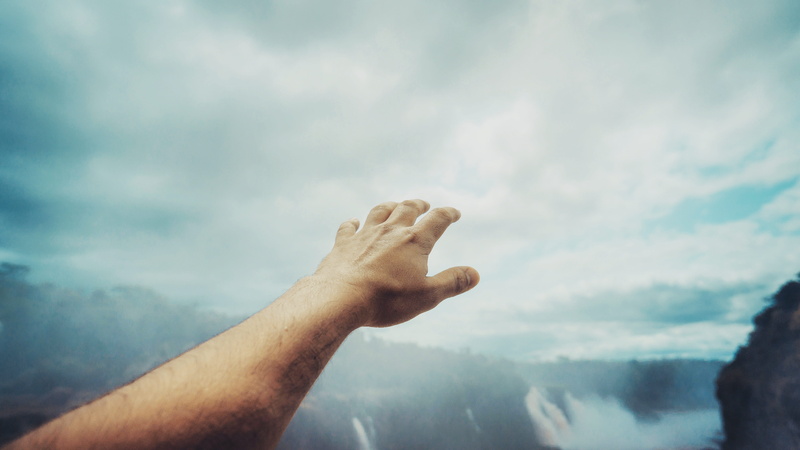 human arm, one person, leisure activity, clouds, religion, hand, man, dom, outdoors, daylight, human hand, spirituality, belief, tranquil scene, men, finger