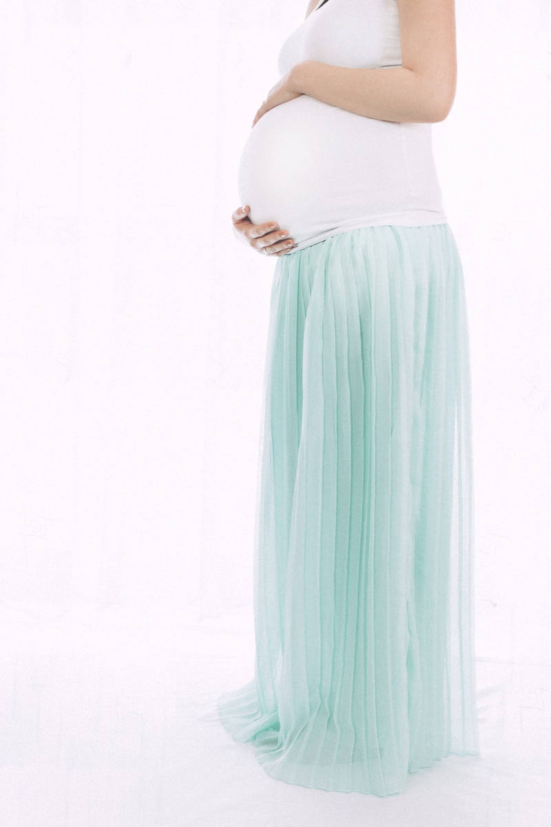 standing, pregnant, beginnings, side view, hands on stomach, women, lifestyles, white color, adult, white background, hope - concept, one person, woman