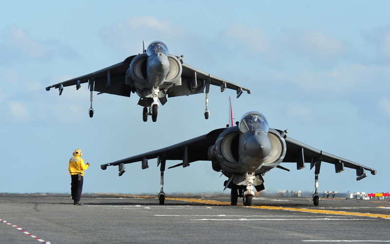 airplane, mode of transportation, full length, airport runway, industry, adult, one person, military, freight transportation, business, av 8b harrier ii military aircraft aircraft