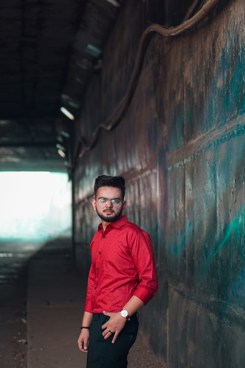 outdoors, architecture, wearing, looking at camera, casual clothing, young adult, glasses, standing, lifestyles, young men, model, day, one person, wear