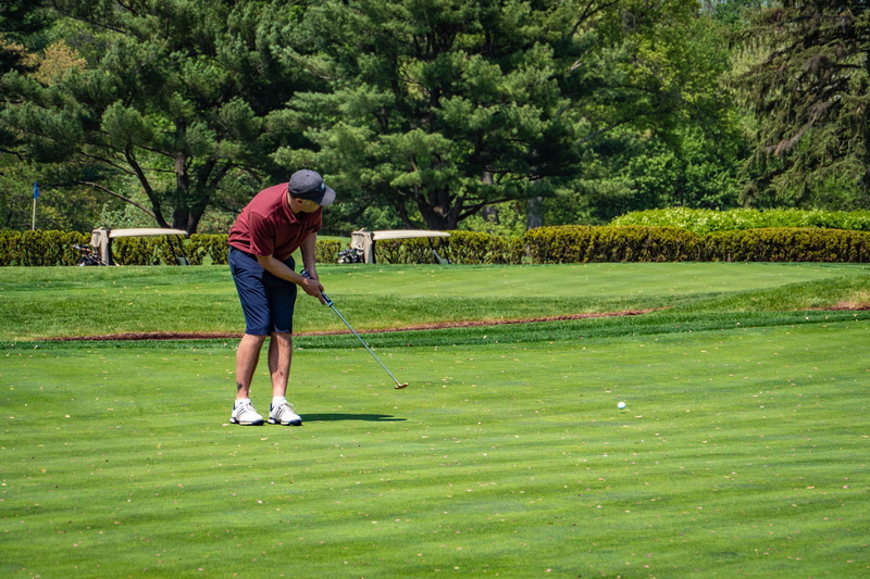 real people, taking a shot - sport, tree, 5K, driver - golf club, lifestyles, playing, plant, one person, leisure activity, full length, green - golf course