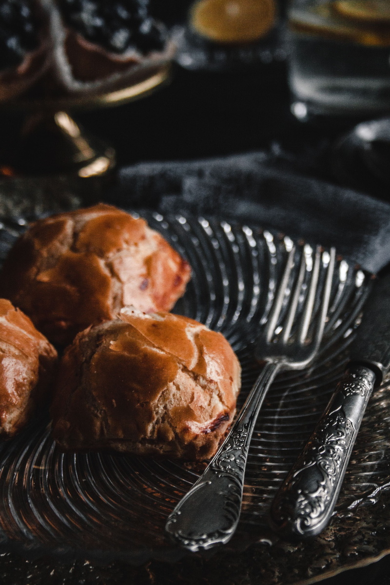 buns, eating utensil, cream, food and drink, unhealthy eating, snack, indoors, sweet food, indulgence, close-up, temptation, table, baked pastry item, cheese