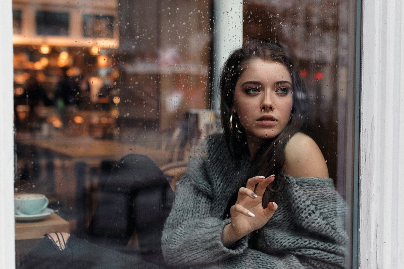 winter, window, freckles, portrait, straight hair, torn jeans, rain, depression - sadness, sitting, close up, warm clothing, mood, one person, looking away