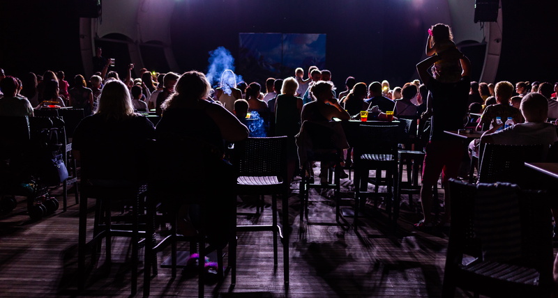 stage, entertainment event, festival, group, spectators, furniture, nightlife, large group of people, women, popular music concert, gathering, inside, performance