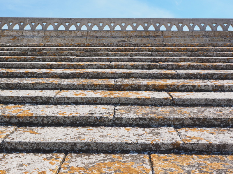 beige, building exterior, notre-dame-de-la-mer, low angle view, concrete, building, stone steps, no people, direction, nature, church roof, wall - building feature