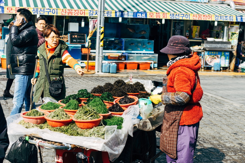 pusan, food and drink, daily life, apparel, street market, person, food, busan, south korea, bucket, shouting, market stall, people, outdoors, warm clothing
