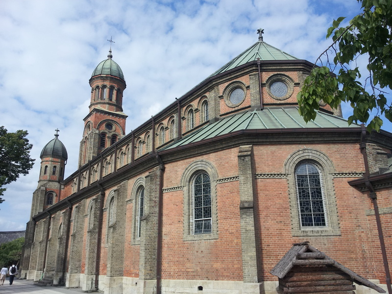 low angle view, building, built structure, belief, dome, cloud - sky, outdoors, place of worship, hanok village, roman catholic, architecture, spirituality