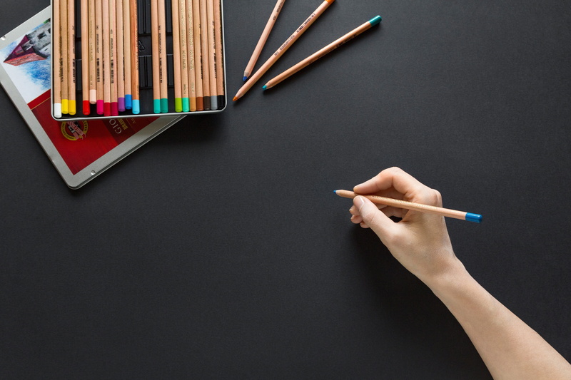 studio shot, high angle view, creativity, indoors, pencil, close-up, human hand, art and craft, hand, holding, art, education, portrait, person, writing instrument