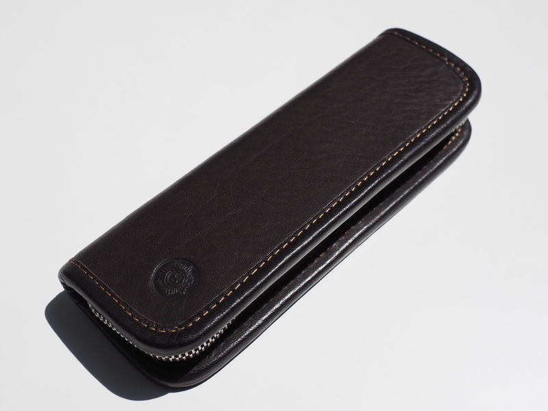 indoors, still life, personal accessory, case, high angle view, 4K, zip, history, single Object, studio shot, leather writing-case, currency, leather case