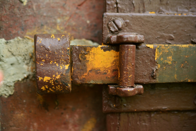 damaged, wood - material, hinge, decline, run-down, outdoors, brown, focus, locked, abandoned, weathered, old door, shut off, door, deterioration, lock