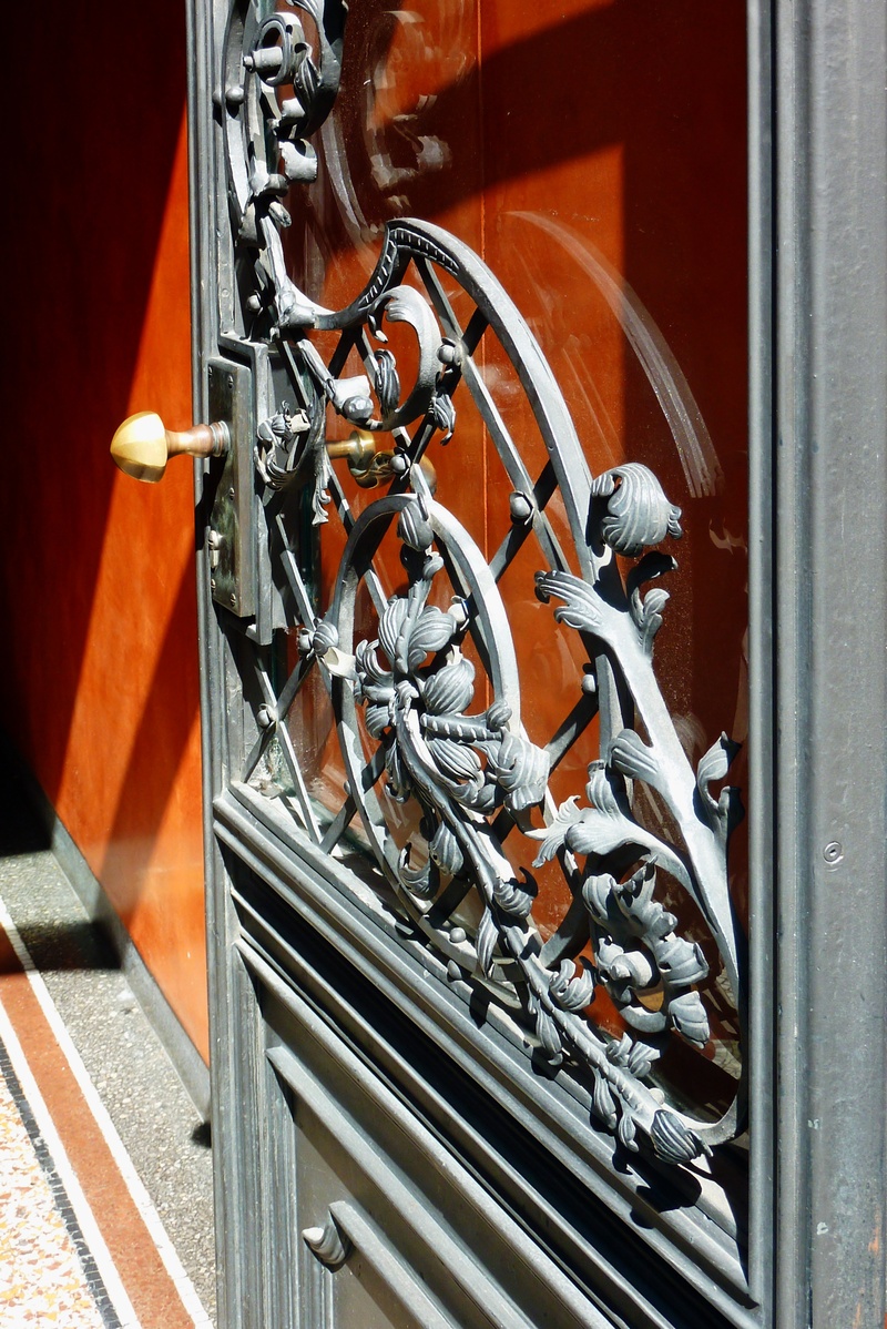 land vehicle, blacksmithing, door, bicycle, window, high angle view, wall - building feature, hinged doors, wood, outdoors, transportation, gate, iron