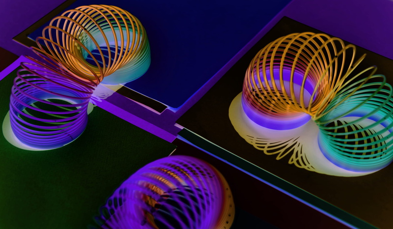 light - natural phenomenon, technology, three, studio shot, slinky, toys, color, arts culture and entertainment, spring, multi colored, blue, purple, ball