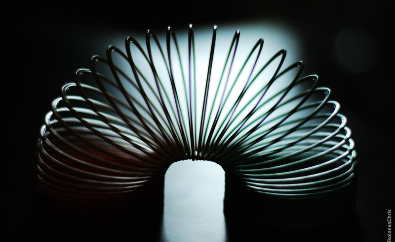 architecture, coiled spring, no people, spiral, spring, illuminated, slinky, pattern, electricity, black background, steel, art and craft, single object