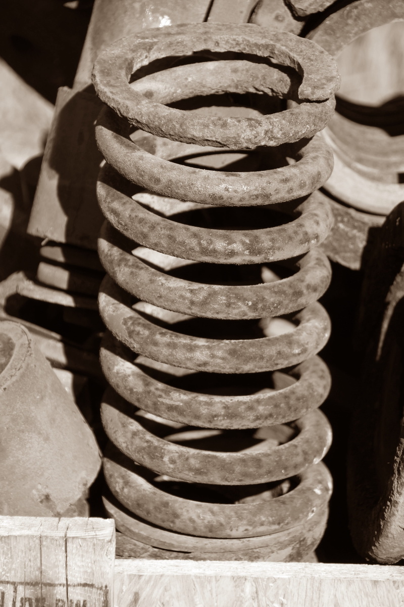close-up, spiral, large group of objects, construction industry, machine part, stack, focus on foreground, nature, sunlight, metal spring, railway, 5K