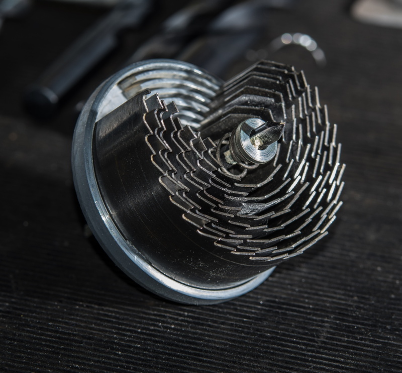 coiled spring, spiral, metal, 4K, selective focus, single object, geometric shape, indoors, work, still life, circle, focus on foreground, drilling, hole drill