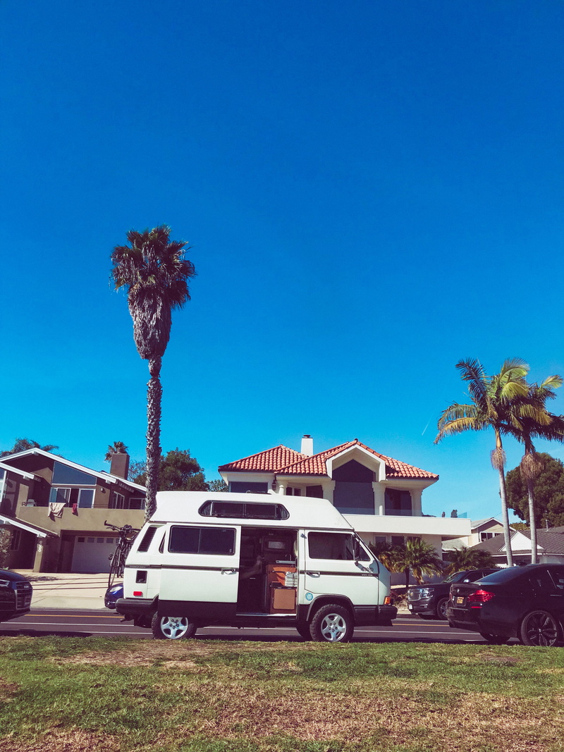 motor vehicle, stationary, ocean, tree, outdoors, palm trees, united states, nature, sky, land vehicle, sunlight, tropical climate, palm tree, plant, built structure