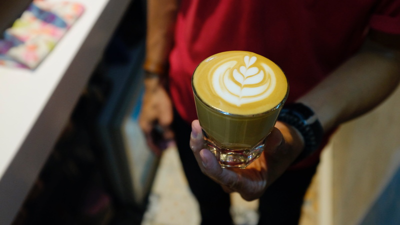 one person, indoors, hand, casual clothing, latte, coffee - drink, drink, cafe, cappuccino art, 4K, coffee art, human hand, holding, food and drink, sleepyhead coffee