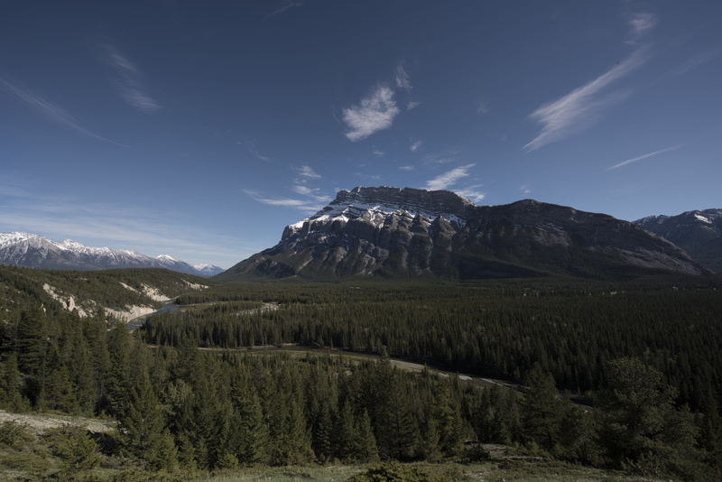 coniferous tree, mountain range, sky, outdoors, formation, forest, day, snowcapped mountain, stream, land, woods, tranquil scene, tunnel mountain, cloud - sky