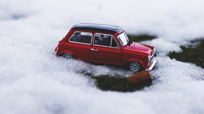 selective focus, motor vehicle, mini cooper, toy, no people, outdoors, car, white, cold temperature, hatchback, motion, focus, sports utility vehicle, road