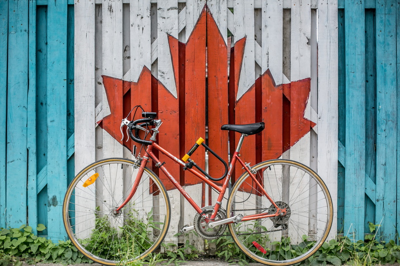 bicycle, maple, wheel, printed, door, outdoors, transportation, red, painted, wall - building feature, fence, orange color, 4K, beside, canada, white