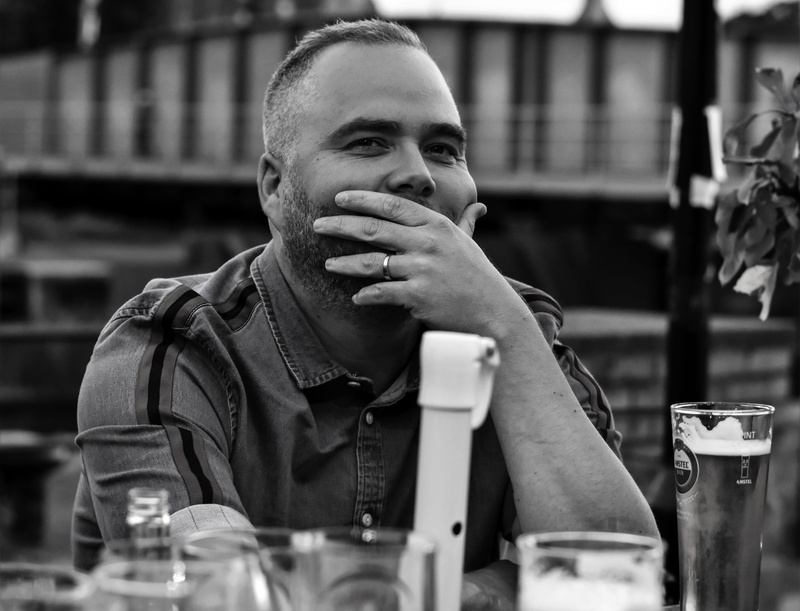looking away, enigmatic, young men, refreshment, bristol, one person, thoughtful, hiding, focus on foreground, real people, lifestyles, restaurant, glass