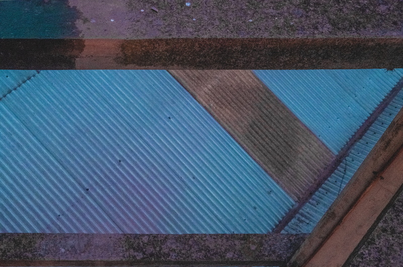 high angle view, metal, architecture, structure, sunlight, 5K, close-up, outdoors, built structure, roof, line, grainy, fujifilm, blue, background, textured