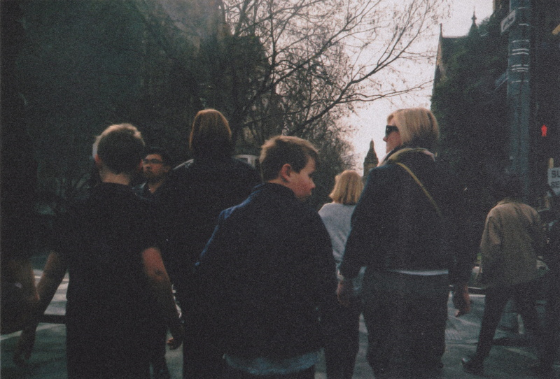 people, tarmac, adult, men, vintage, group of people, afro hairstyle, street, walking, city, togetherness, asphalt, child, rear view, grey, tree, kid, crowd
