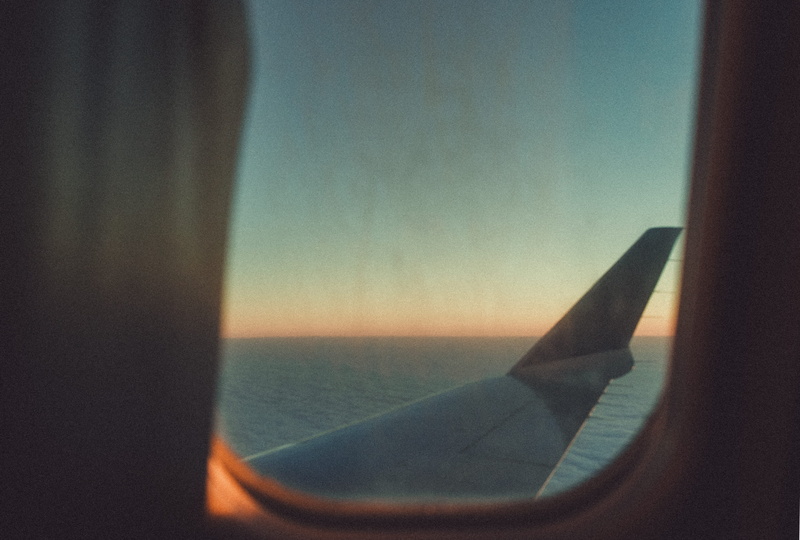 hour, vehicle, international, peeking, glass - material, air vehicle, travel destination, peek, water, transparent, airplane window, air, airplane wing