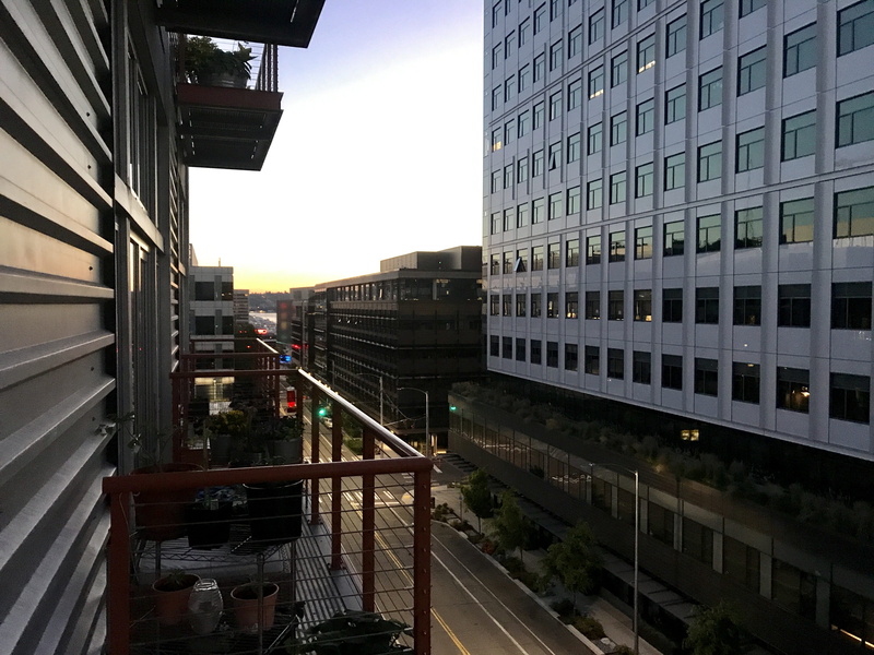 railing, cloud - sky, sunrise, no people, street, transportation, rail transportation, day, office, glass - material, city, office building exterior, united states