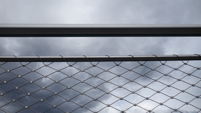 sky, shiny, fence, chainlink Fence, close-up, pattern, cloud - sky, day, low angle view, barrier, built structure, metal, boundary, protection, Wire, Tube