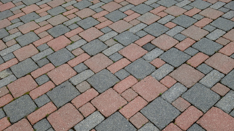 street, paving stones, cobblestone, solid, repetition, patch, stone, pattern, textured, day, outdoors, sign, transportation, geometry, city, backgrounds