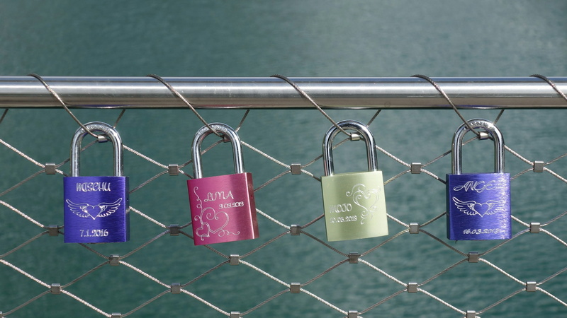 tube, no people, lock, message, shiny, lines, outdoors, bridge railing, castles, regularly, chainlink fence, security, text, positive emotion, communication